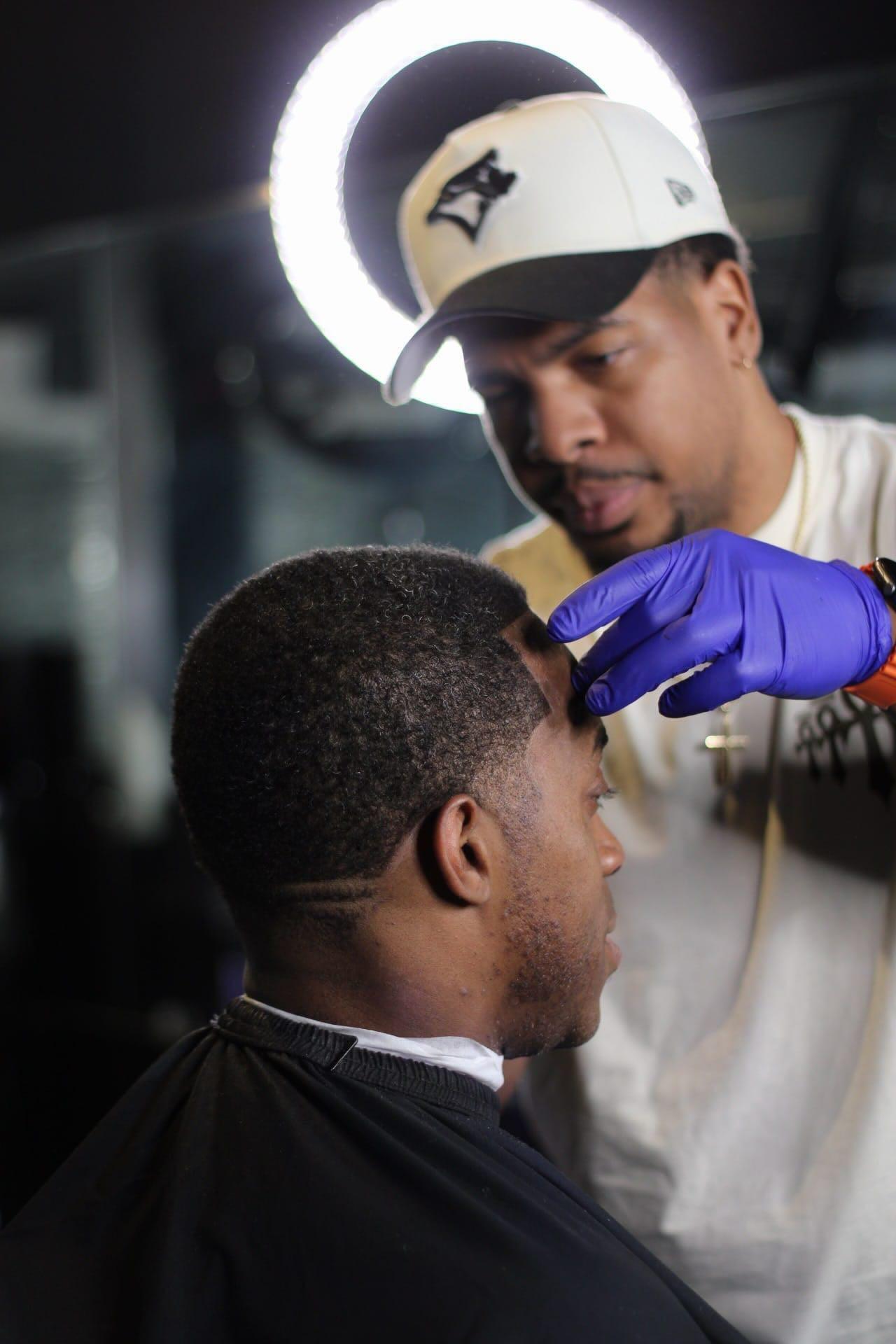 Top5 Studio barbering station and client experience.